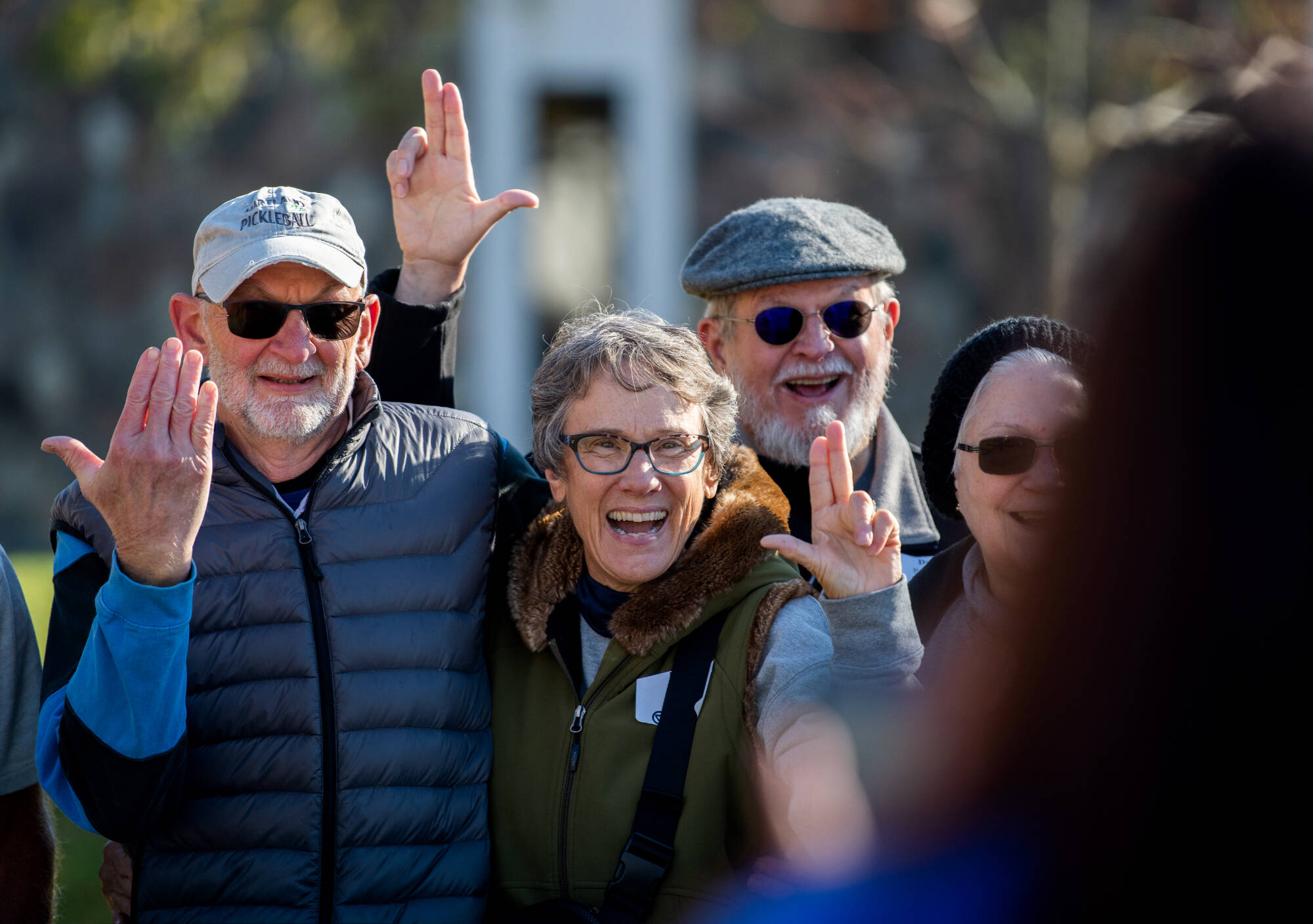 Jim Houge, ’74, Diane Houge, Pat Baxter, ’74, Dale Baxter, ’74, pose for a photo as they tour campus